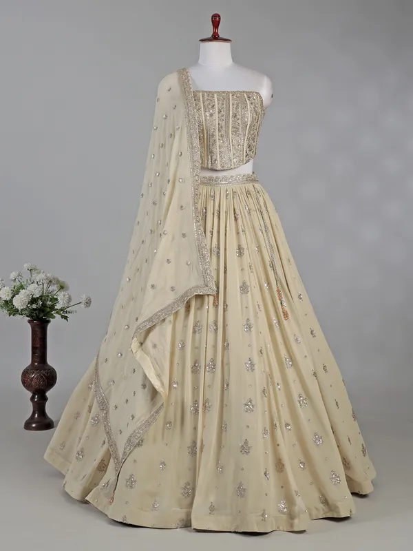 Cream georgette lehenga choli with resham detailing