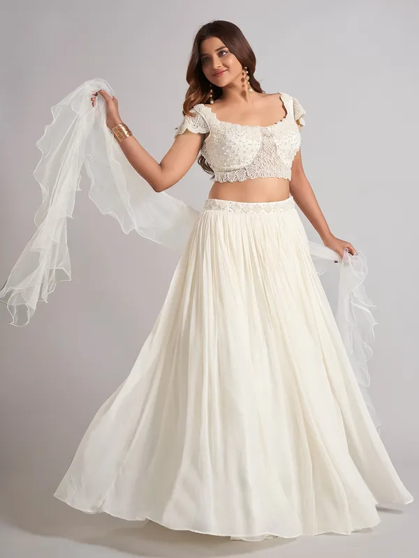 Cream georgette pearl lehenga choli with ruffle dupatta