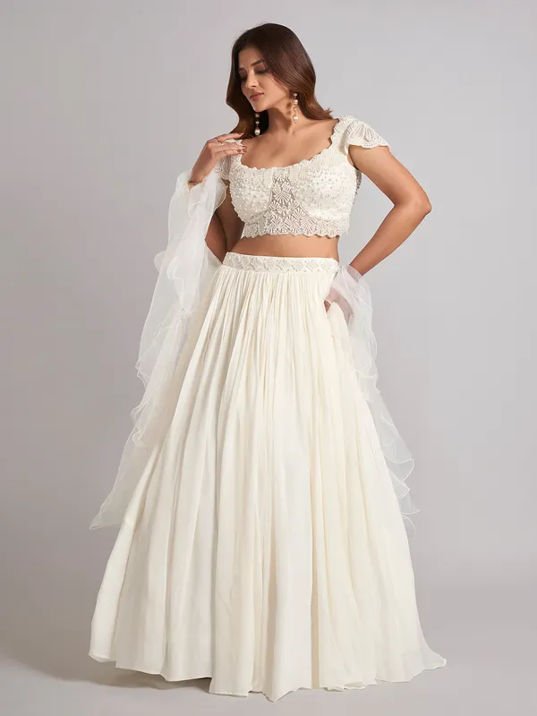 Cream georgette pearl lehenga choli with ruffle dupatta