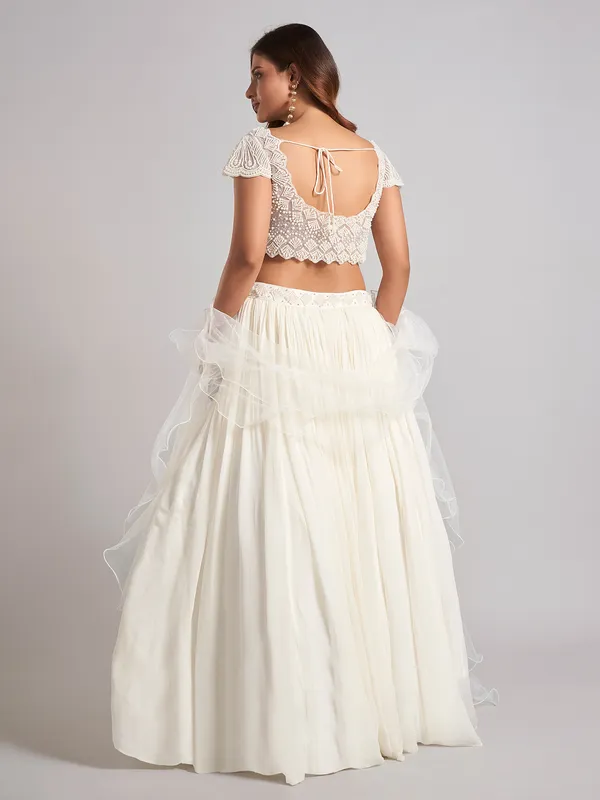 Cream georgette pearl lehenga choli with ruffle dupatta