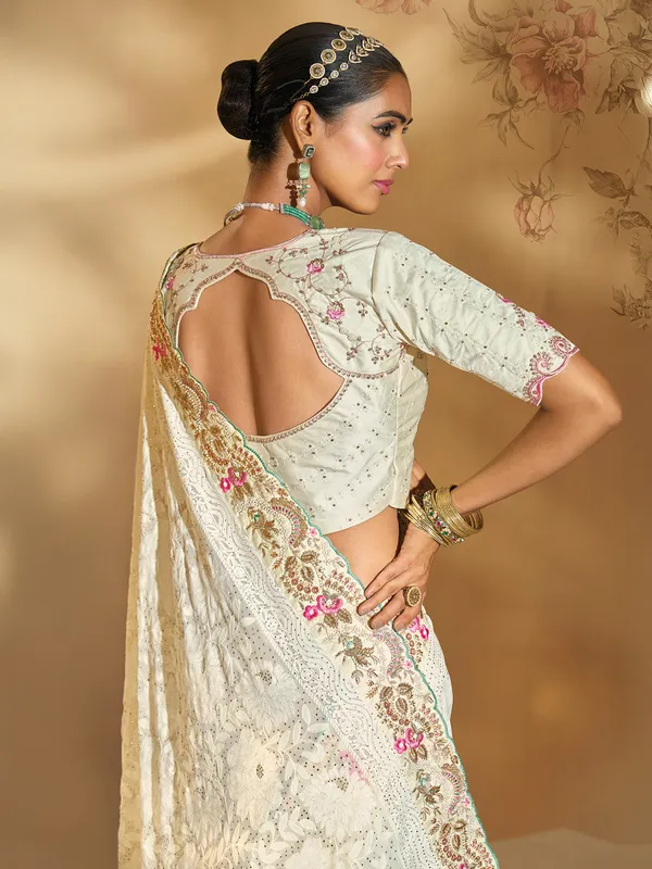 Cream georgette saree with thread detailing