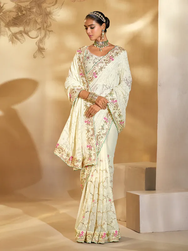 Cream georgette saree with thread detailing