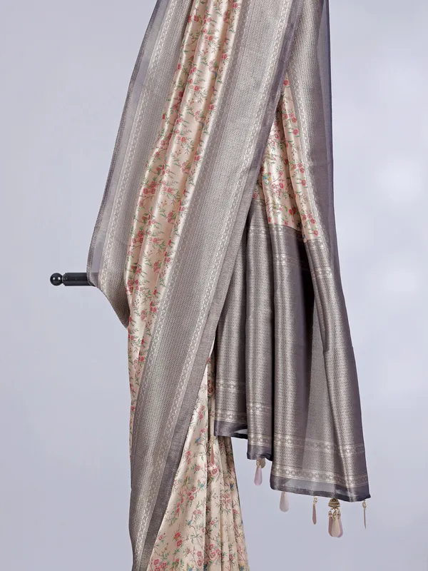 Cream georgette silk saree with contrast floral design