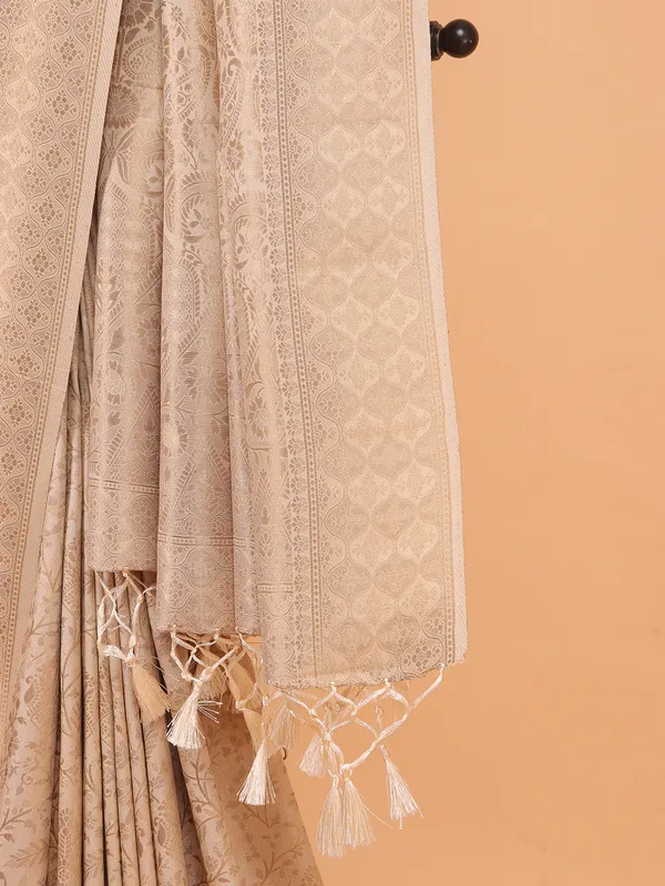 Cream kanjivaram silk saree for festive wear