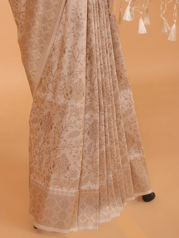 Cream kanjivaram silk saree for festive wear