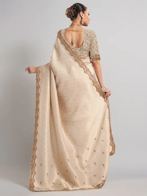 Cream kanjivaram silk saree with classic zari weaving