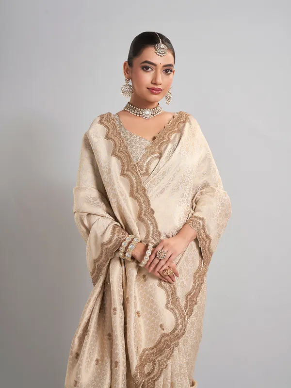 Cream kanjivaram silk saree with classic zari weaving