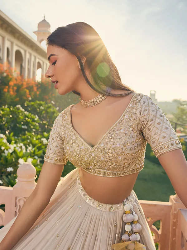Cream lehenga choli with dupatta in georgette