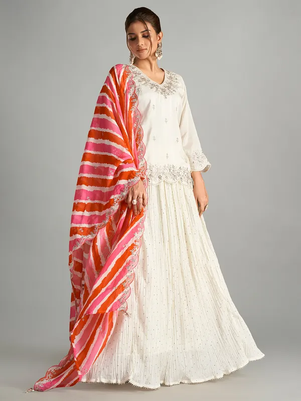 Cream lehenga suit with leheriya dupatta