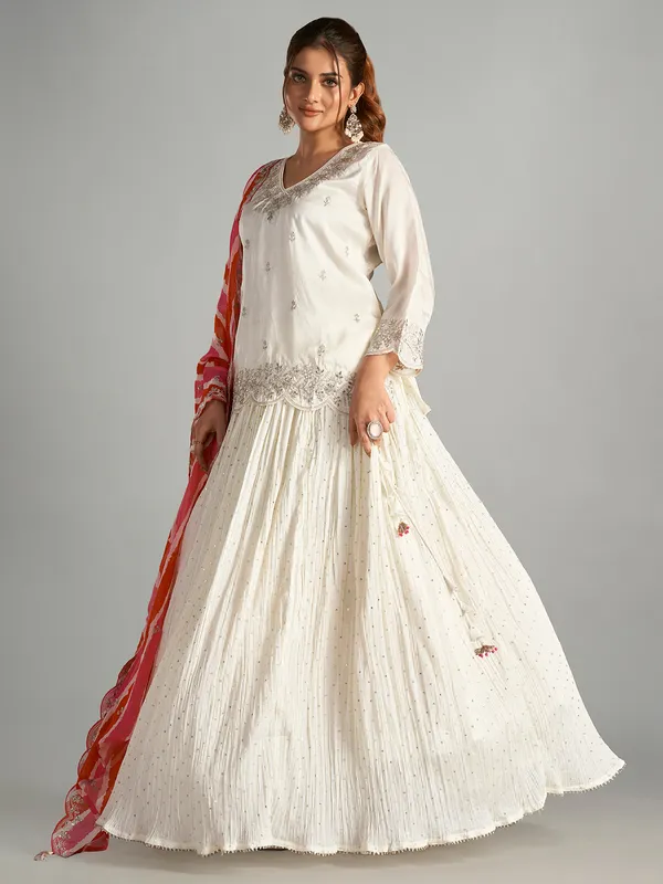 Cream lehenga suit with leheriya dupatta