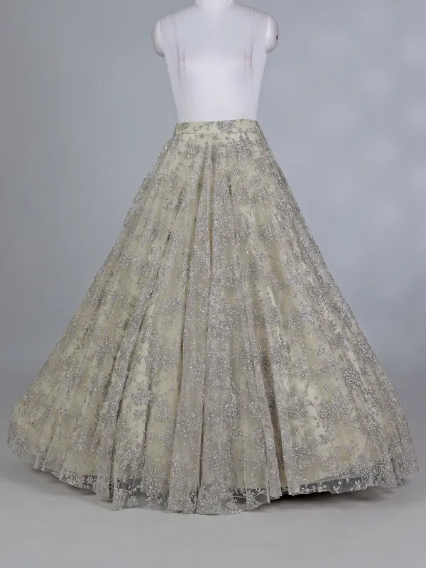 Cream net bridal lehenga choli with zardosi work