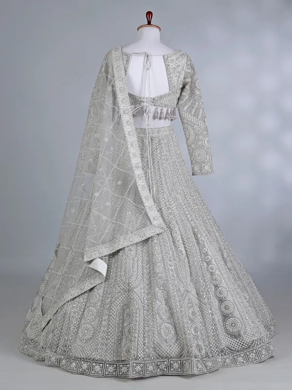 Cream net embellished lehenga choli for wedding wear
