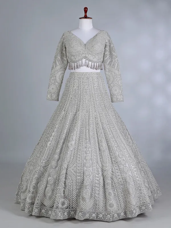 Cream net embellished lehenga choli for wedding wear