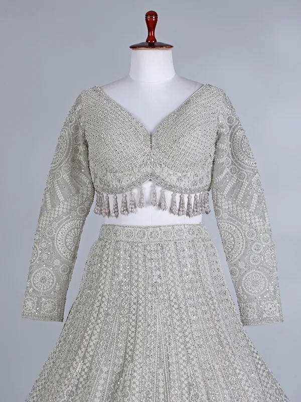 Cream net embellished lehenga choli for wedding wear