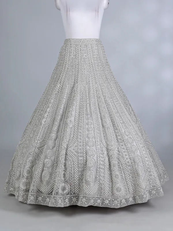 Cream net embellished lehenga choli for wedding wear