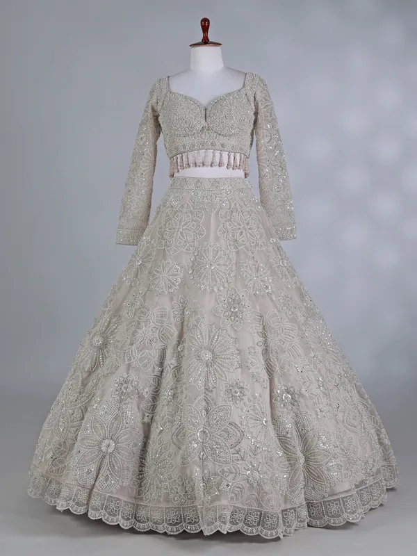 Cream net sweetheart neck lehenga choli with dupatta
