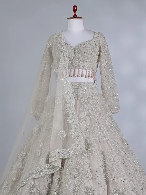 Cream net sweetheart neck lehenga choli with dupatta