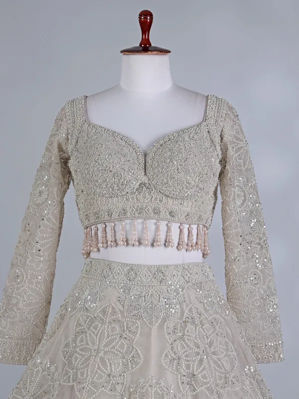 Cream net sweetheart neck lehenga choli with dupatta