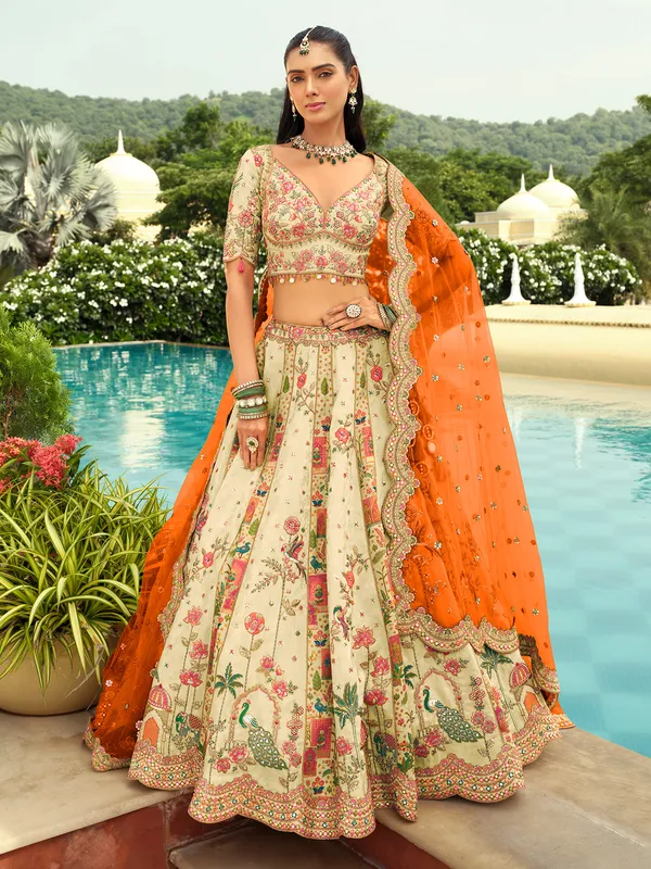 Cream orange peacock silk lehenga choli
