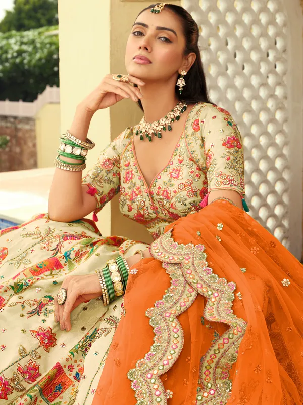 Cream orange peacock silk lehenga choli