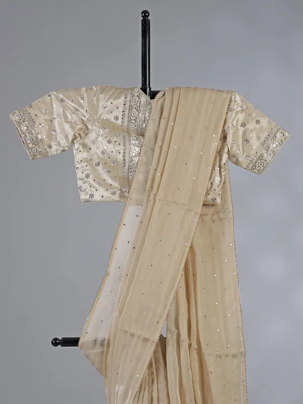 Cream organza saree with ready made blouse