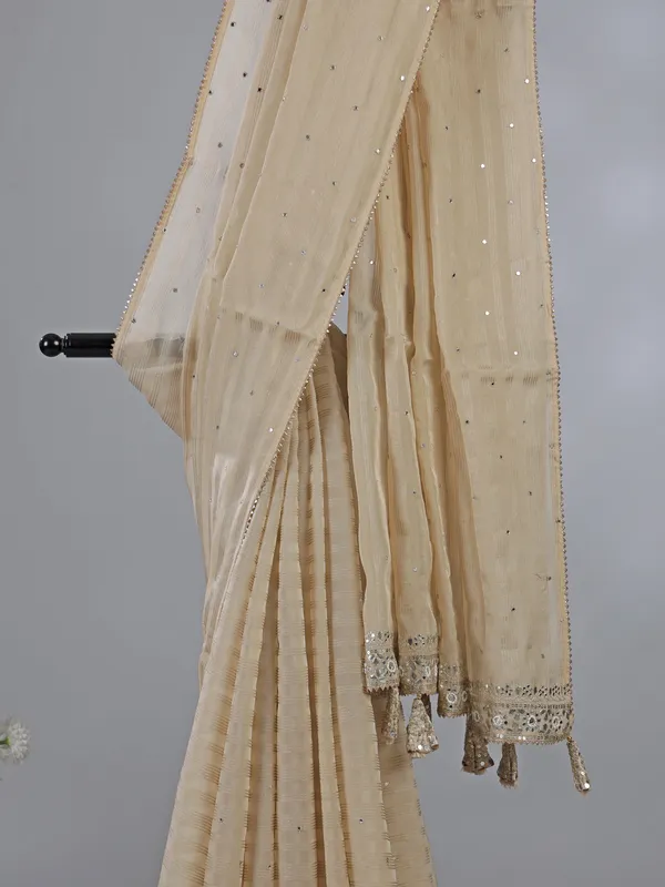Cream organza saree with ready made blouse