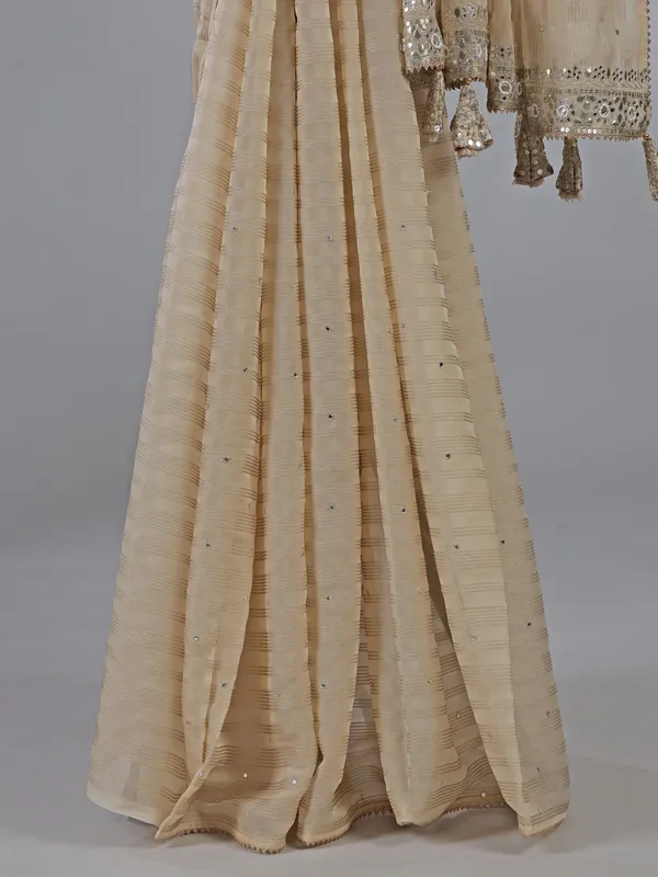 Cream organza saree with ready made blouse