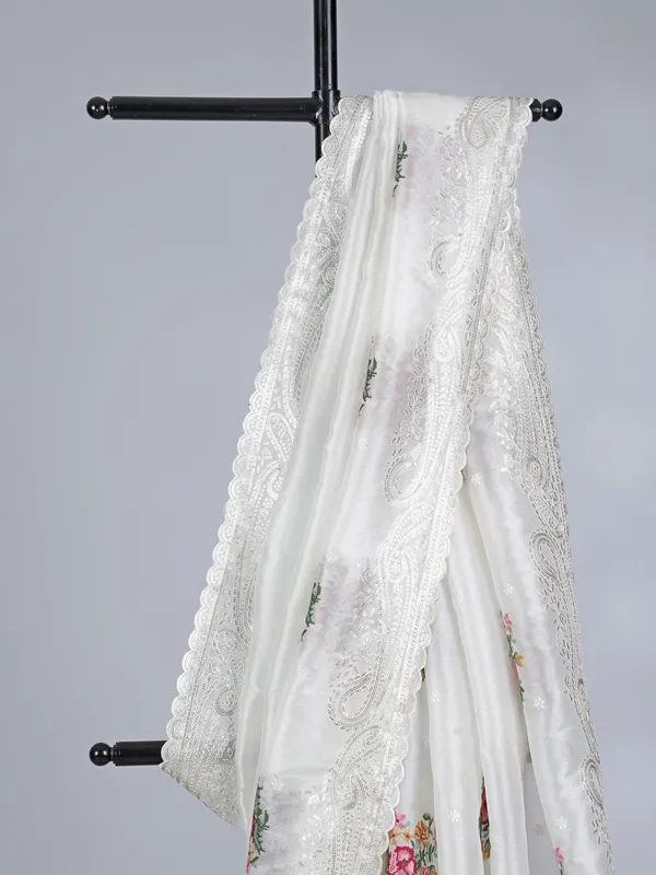 Cream organza saree with sequins detailing