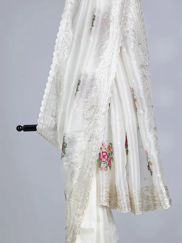 Cream organza saree with sequins detailing