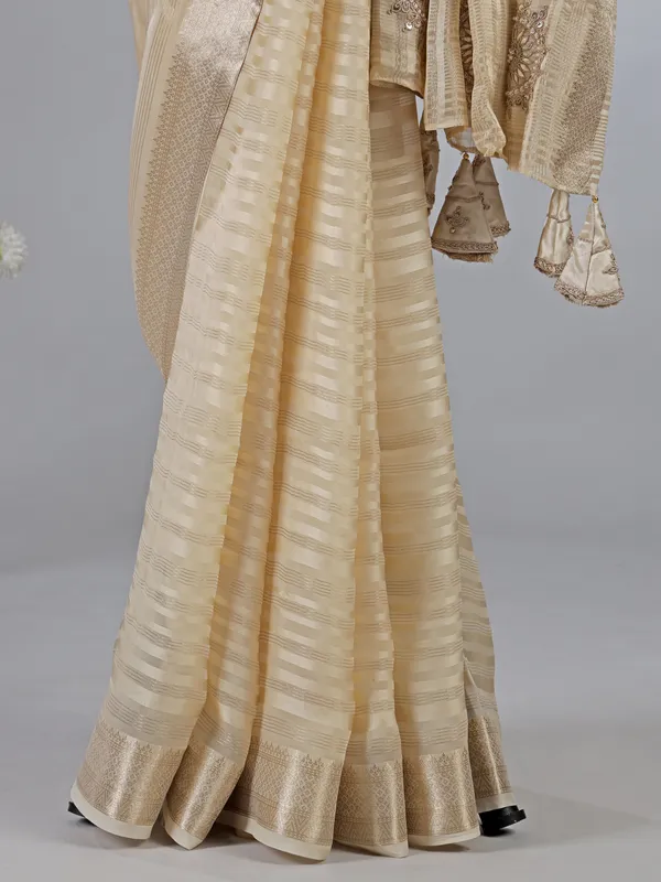 Cream organza satin silk saree with zardosi work