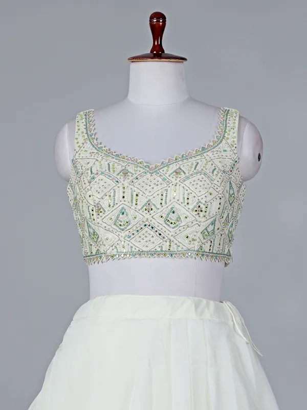 Cream organza sleeveless designer lehenga choli with dupatta