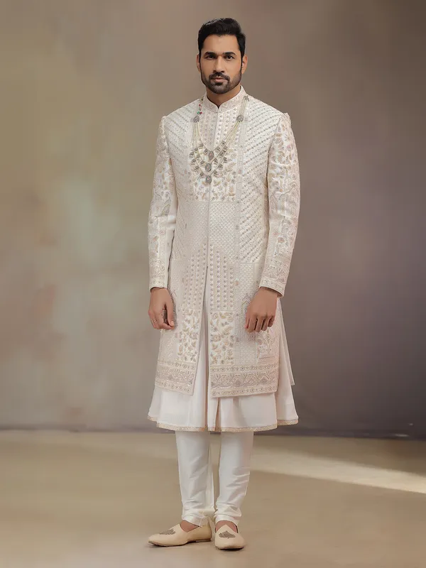 Cream peshwa style silk sherwani with rich embroidery