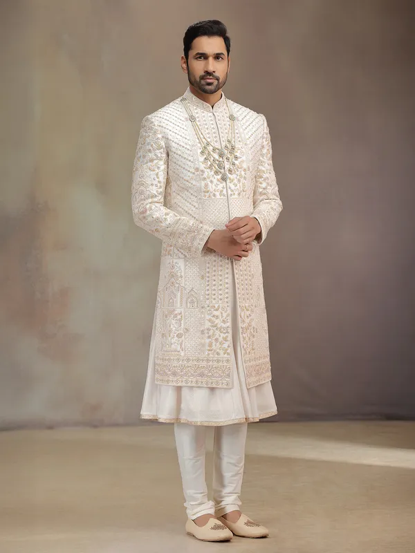 Cream peshwa style silk sherwani with rich embroidery