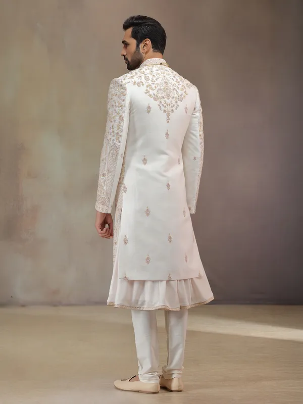 Cream peshwa style silk sherwani with rich embroidery