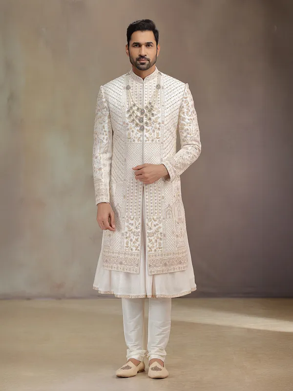 Cream peshwa style silk sherwani with rich embroidery