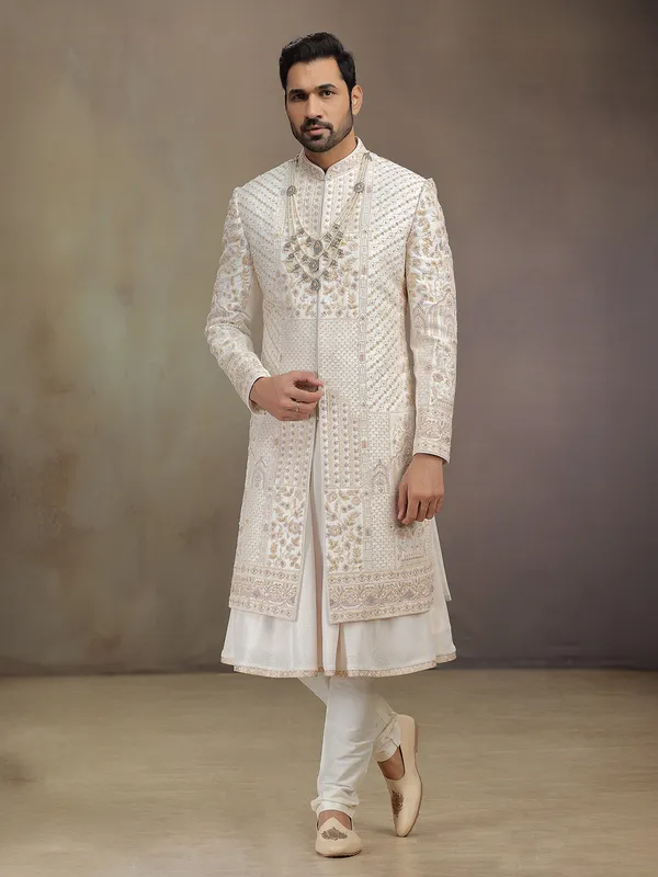 Cream peshwa style silk sherwani with rich embroidery