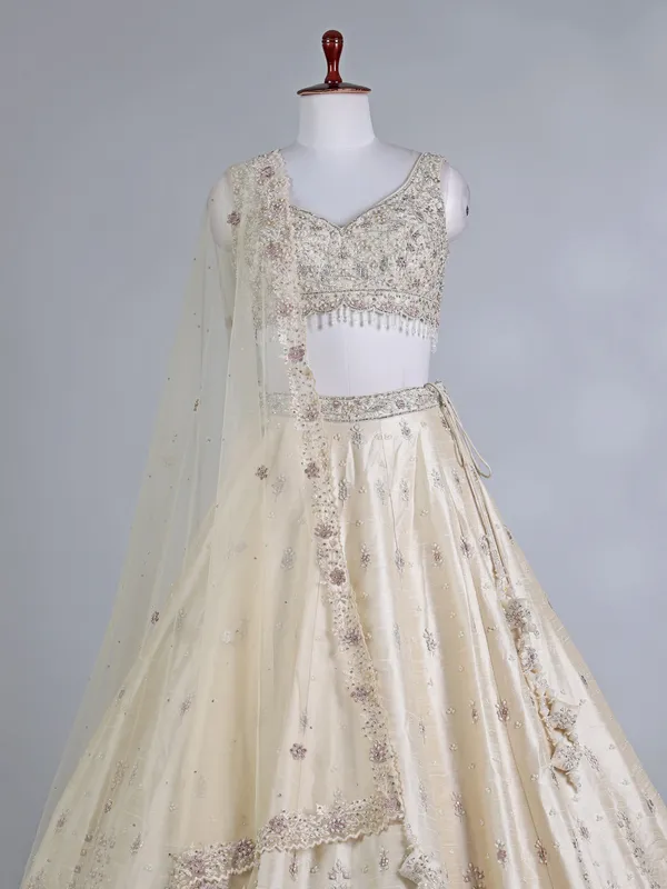 Cream raw silk bridal lehenga choli with sequins work