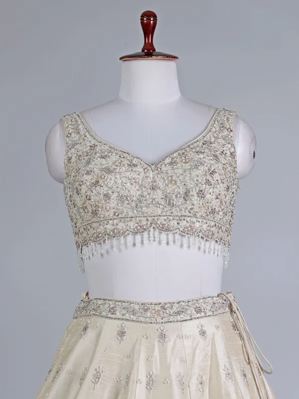 Cream raw silk bridal lehenga choli with sequins work