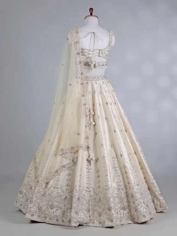 Cream raw silk bridal lehenga choli with sequins work