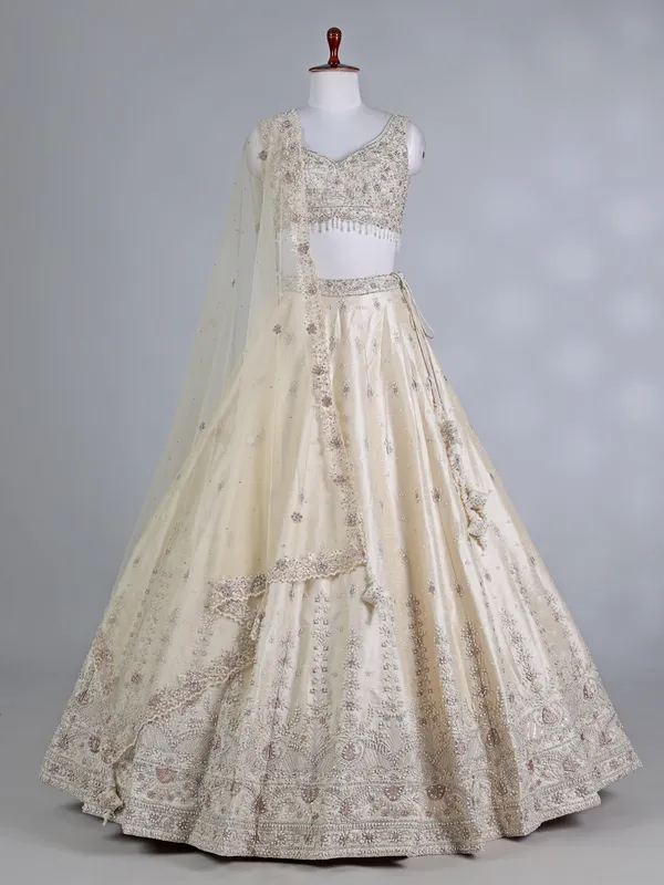 Cream raw silk bridal lehenga choli with sequins work