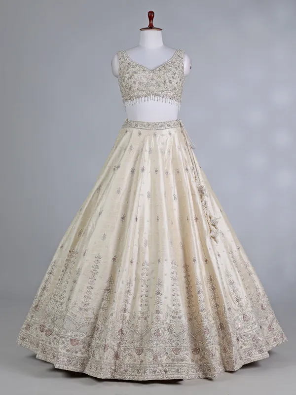 Cream raw silk bridal lehenga choli with sequins work