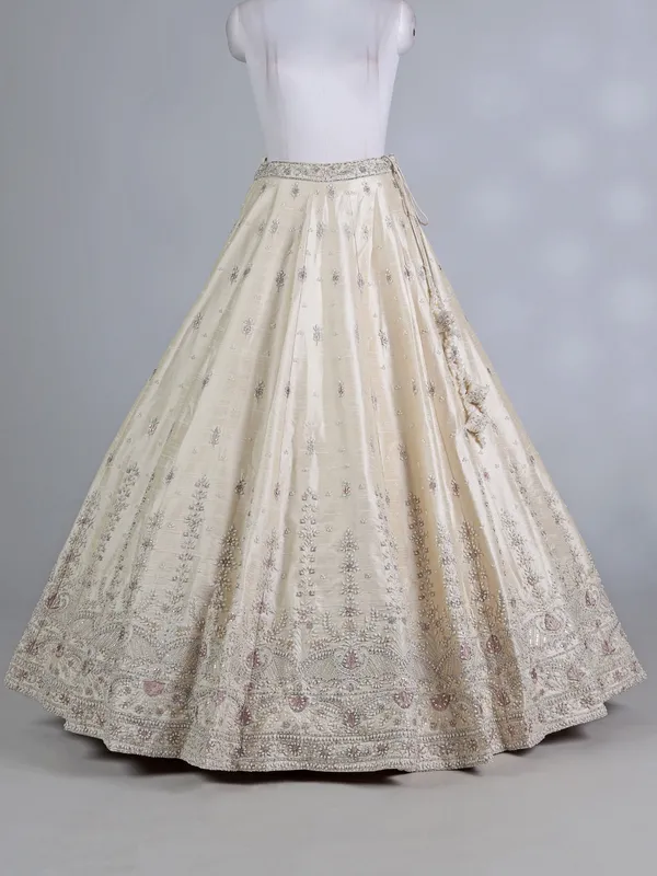 Cream raw silk bridal lehenga choli with sequins work