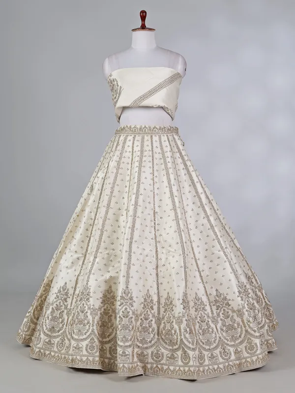 Cream raw silk bridal lehenga choli with zardosi work