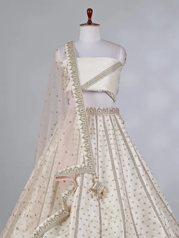 Cream raw silk bridal lehenga choli with zardosi work