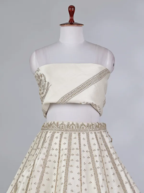 Cream raw silk bridal lehenga choli with zardosi work