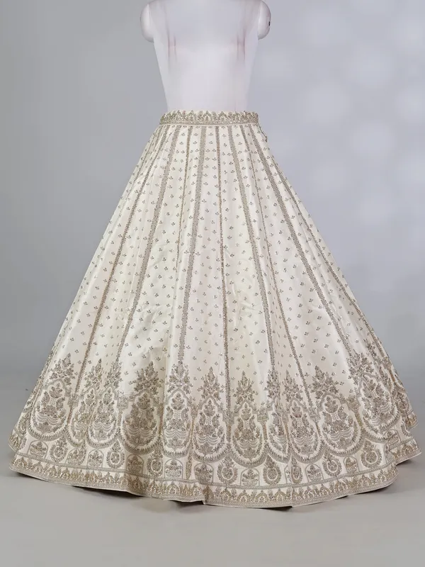 Cream raw silk bridal lehenga choli with zardosi work