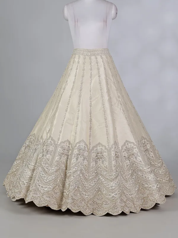 Cream raw silk lehenga choli with cutdana embellishments