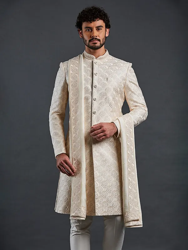 Cream raw silk sherwani in finest work for groom