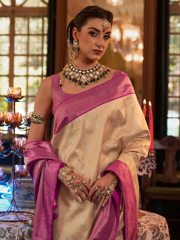 Cream saree with contrast border