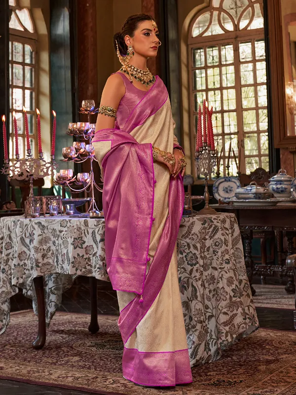 Cream saree with contrast border